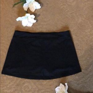 Black running skort by Champion
